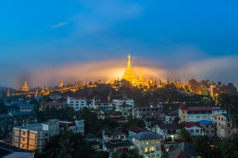 Shwedagon Paya pagoda in Gold Mist in the morning before sunrise .Myanmar famous sacred place and tourist attraction landmark.Yangon, Myanmar